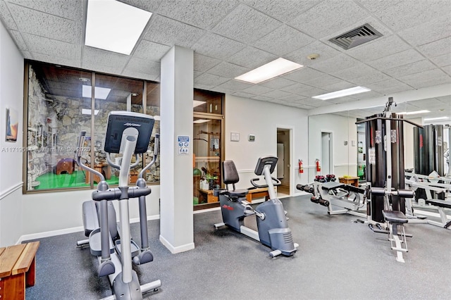 exercise room with a paneled ceiling