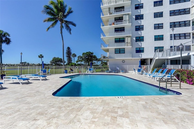 view of pool featuring a patio