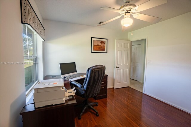 office area with dark hardwood / wood-style floors and ceiling fan