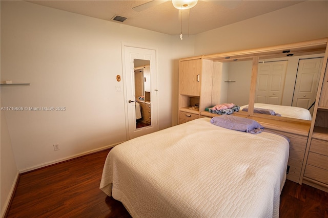 bedroom featuring ceiling fan and dark wood-type flooring