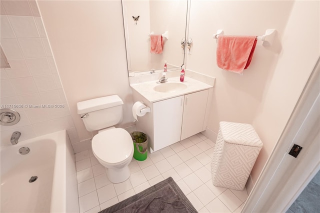 bathroom featuring tile patterned flooring, vanity, and toilet