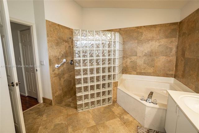 bathroom with shower with separate bathtub and vanity