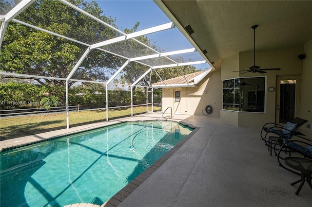 view of pool with a lanai, a patio area, and ceiling fan