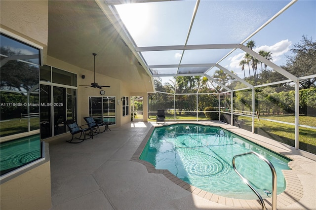 view of swimming pool featuring a patio area and a lanai