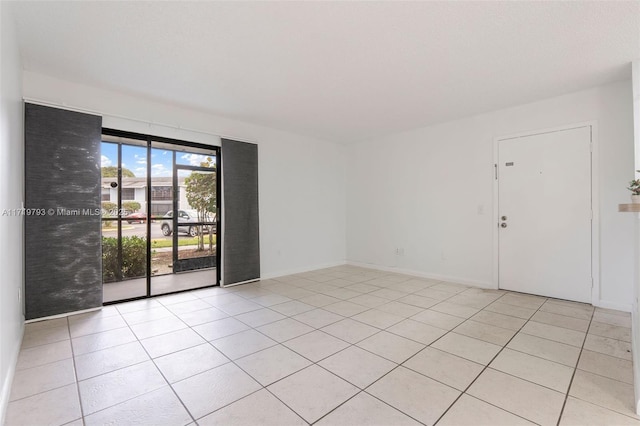 view of tiled spare room