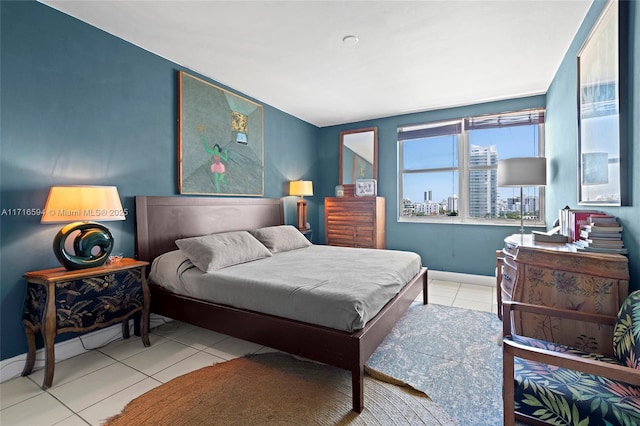 bedroom with light tile patterned floors