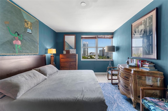 bedroom with light tile patterned floors