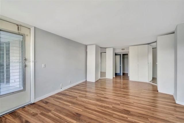 unfurnished bedroom featuring light wood-type flooring