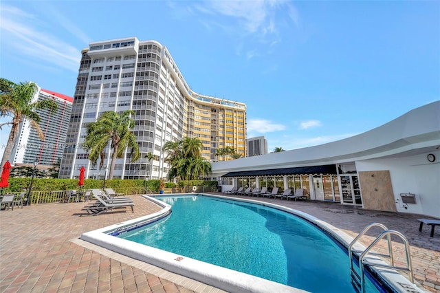 view of swimming pool featuring a patio area