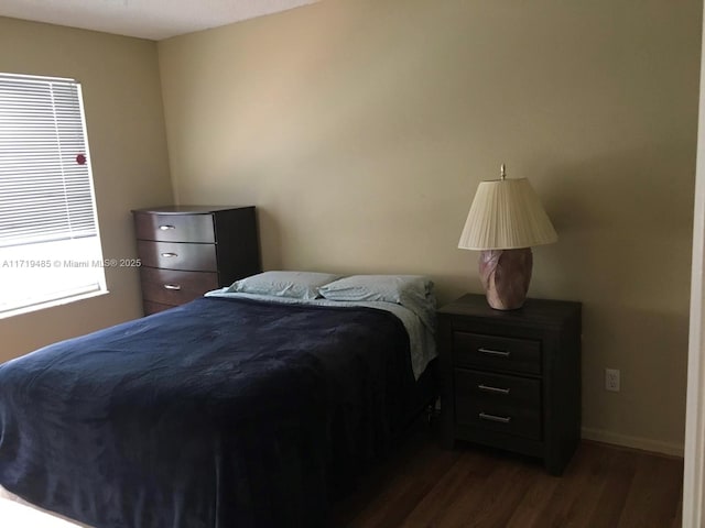 bedroom featuring dark hardwood / wood-style floors