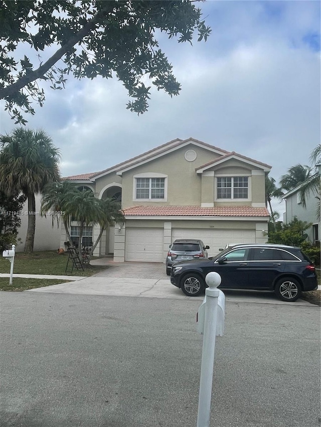 view of front of property with a garage