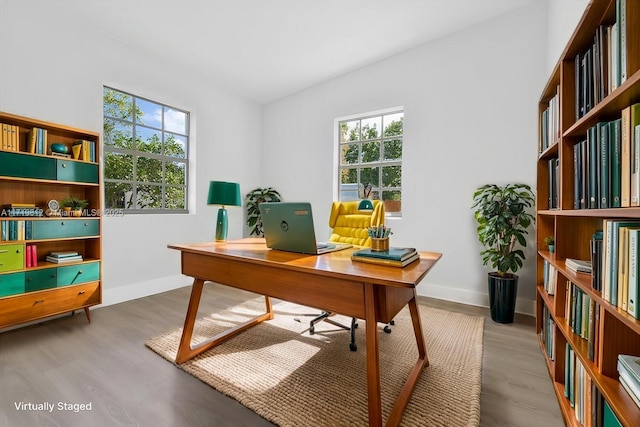 office area featuring baseboards and wood finished floors