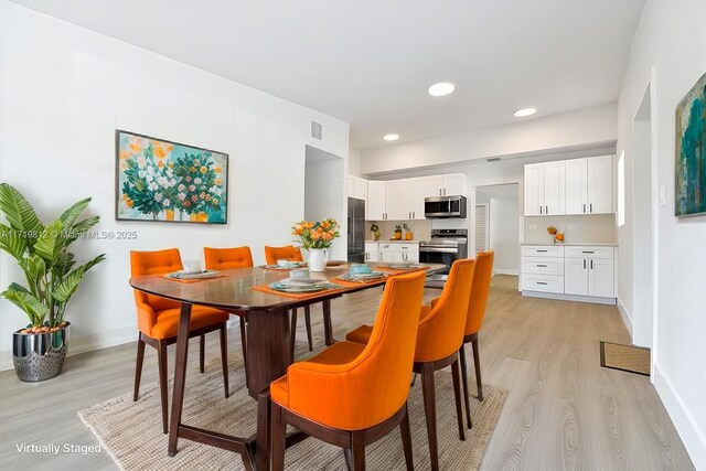 dining room with baseboards, visible vents, recessed lighting, and light wood-type flooring