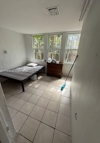 unfurnished bedroom with light tile patterned floors