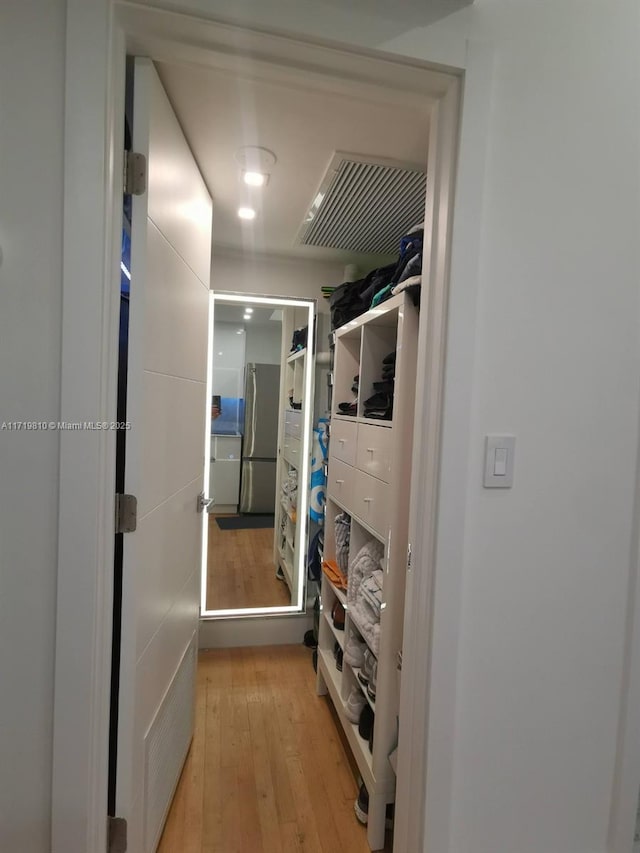 spacious closet with light wood-type flooring