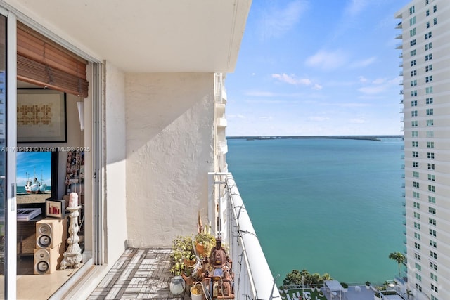 balcony featuring a water view