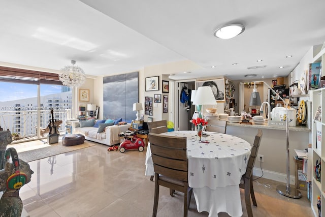 dining room featuring a wall of windows and an inviting chandelier