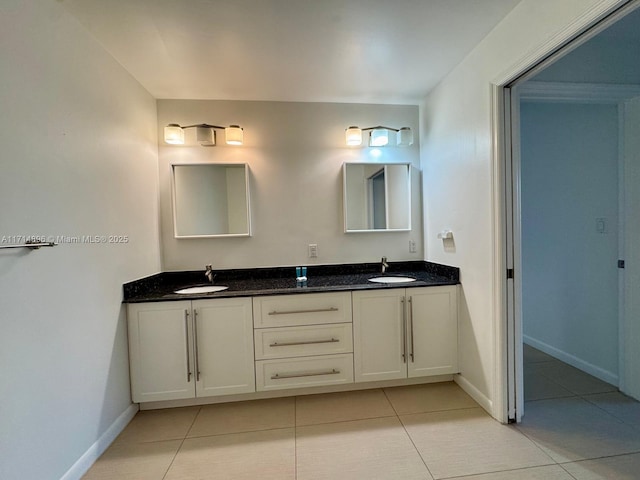 bathroom with tile patterned floors and vanity