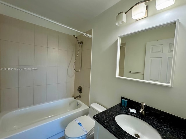 full bathroom featuring vanity, toilet, and tiled shower / bath