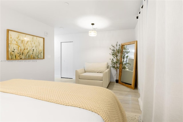 bedroom with light wood-type flooring