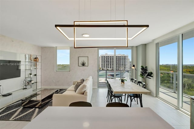 dining space featuring a wall of windows