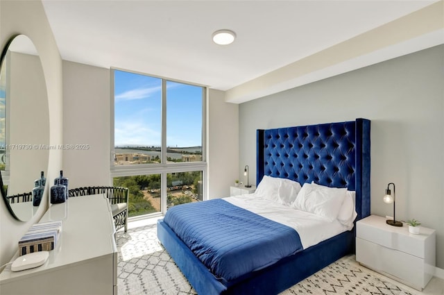 bedroom featuring a wall of windows