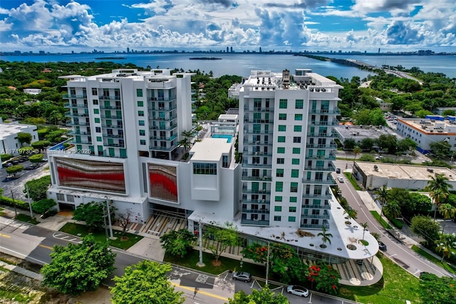 birds eye view of property with a water view