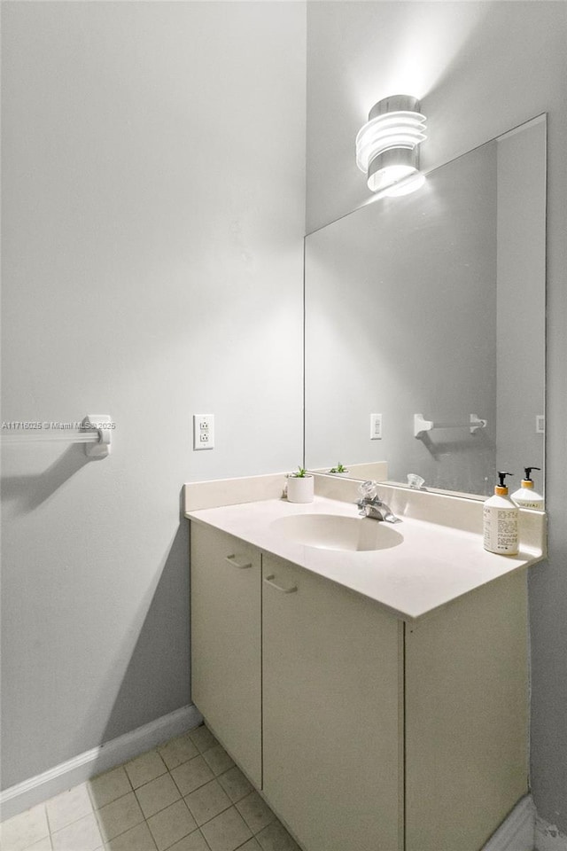 bathroom with tile patterned floors and vanity