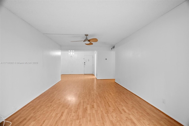 spare room featuring ceiling fan and light wood-type flooring