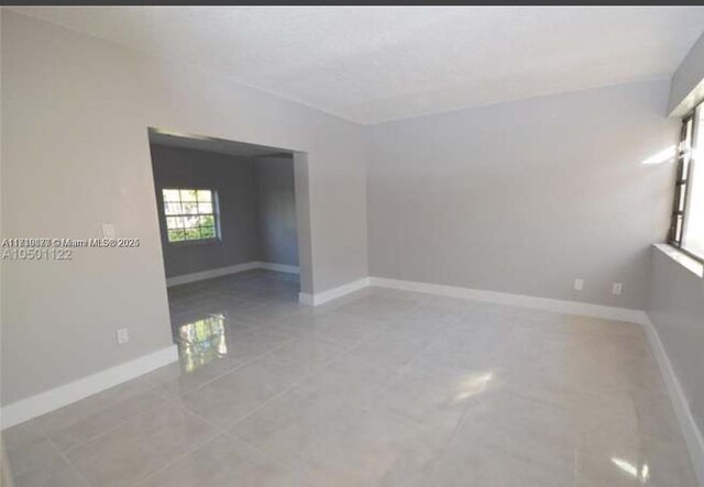 2021 SW 105th Ct, Miami, FL 33165 - corridor featuring tile patterned floors, recessed lighting, and a textured wall