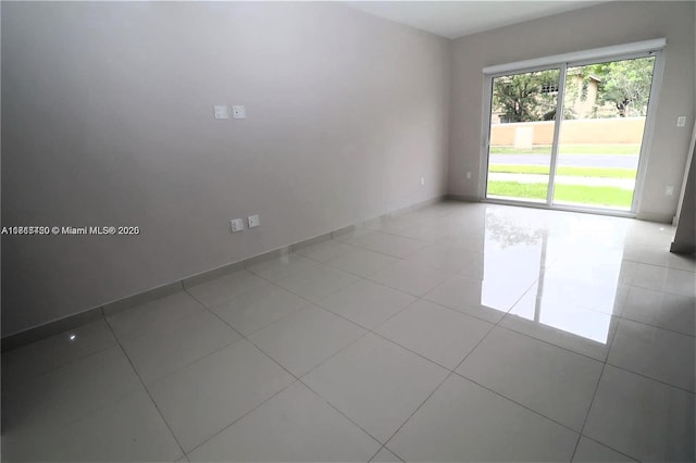 empty room with light tile patterned floors