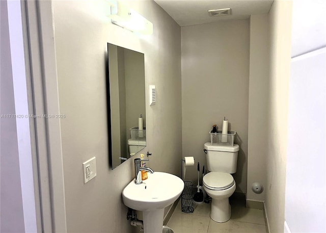 bathroom featuring tile patterned floors, sink, and toilet