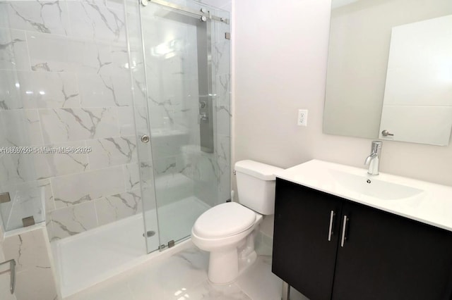 bathroom with vanity, toilet, and a shower with shower door