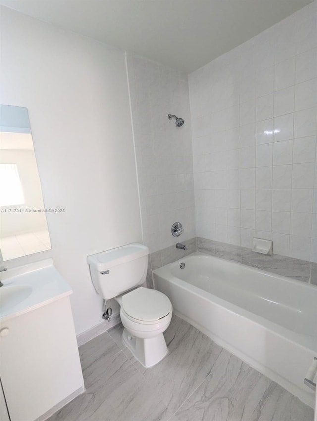 full bathroom with vanity, toilet, and tiled shower / bath combo