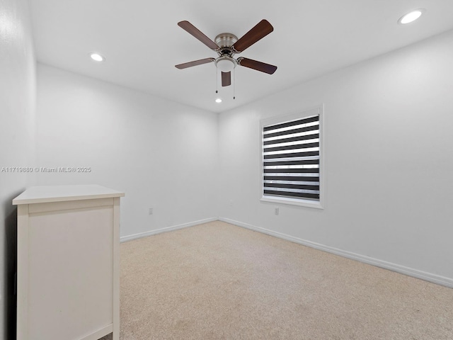 carpeted empty room with ceiling fan