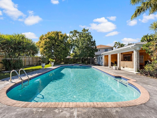 view of pool featuring a patio