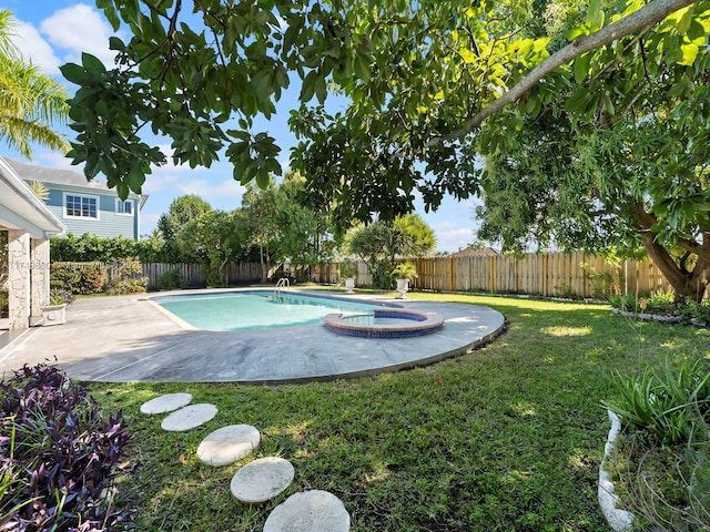 view of swimming pool featuring a patio and a lawn