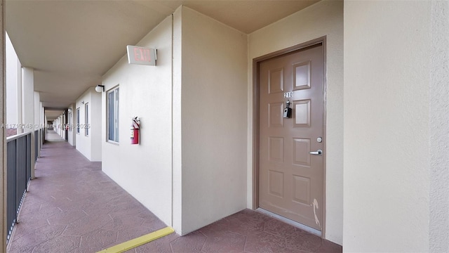 entrance to property featuring a balcony