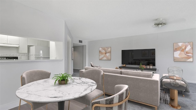 dining area with vaulted ceiling