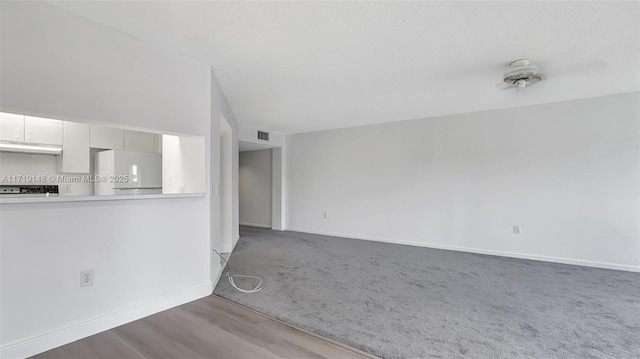 unfurnished living room with carpet