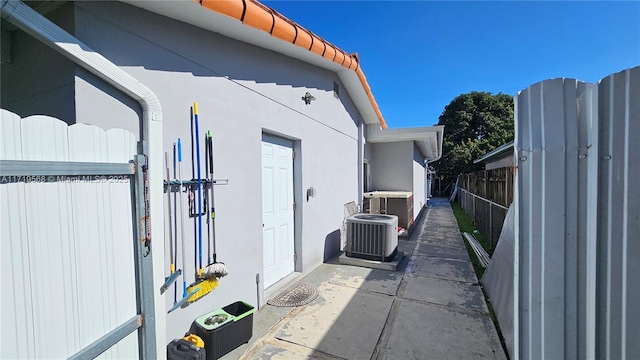 view of property exterior with central AC unit