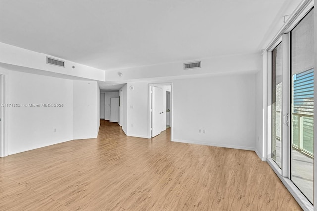 unfurnished room featuring light wood-type flooring