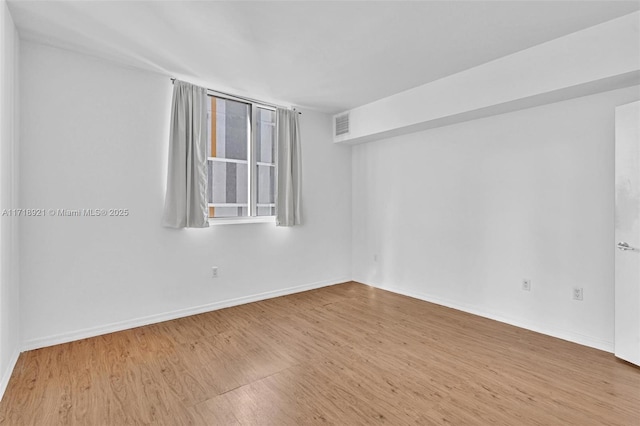 unfurnished room featuring light wood-type flooring