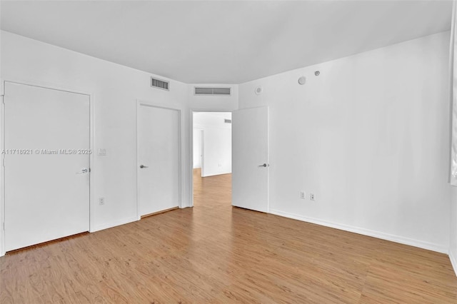 unfurnished bedroom with light hardwood / wood-style flooring