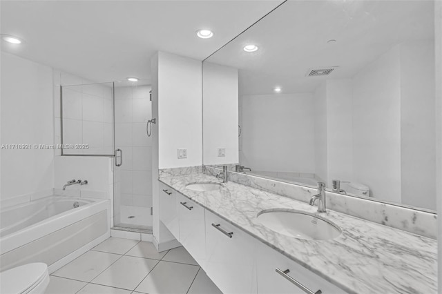 full bathroom featuring separate shower and tub, tile patterned flooring, vanity, and toilet