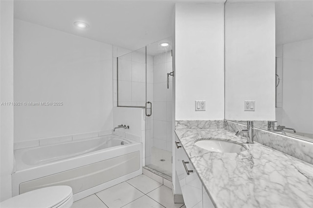 full bathroom featuring tile patterned floors, vanity, independent shower and bath, and toilet