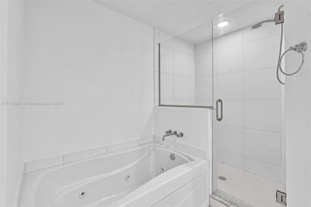 bathroom featuring a shower with shower door