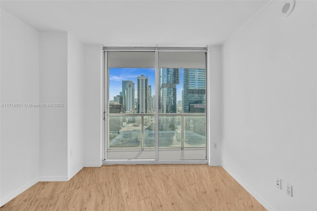 empty room with light hardwood / wood-style floors