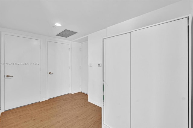 unfurnished bedroom featuring light wood-type flooring