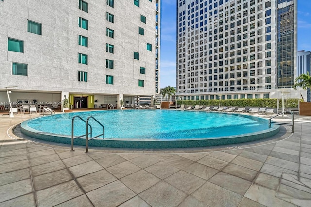 view of swimming pool with a patio area